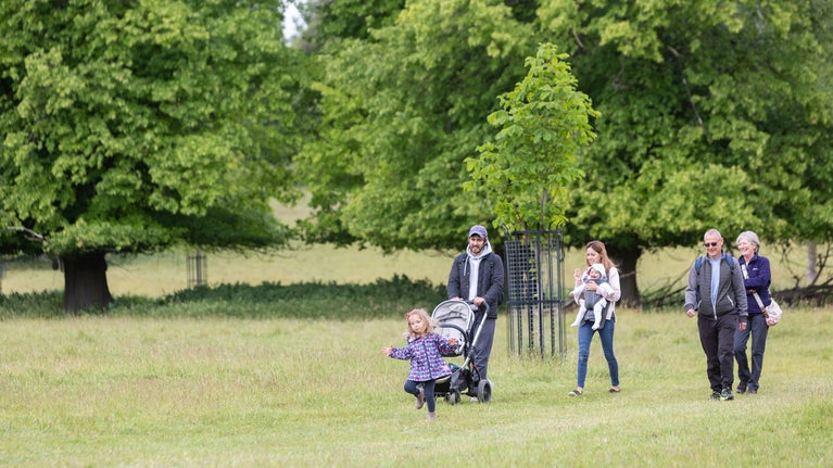 Visitors walking in the grounds of Wimpole Estate, Cambridgeshire